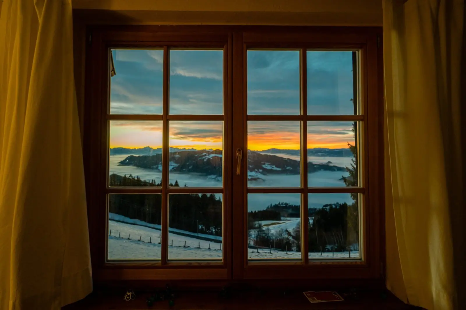 Dawn sky through the window of the Almhaus