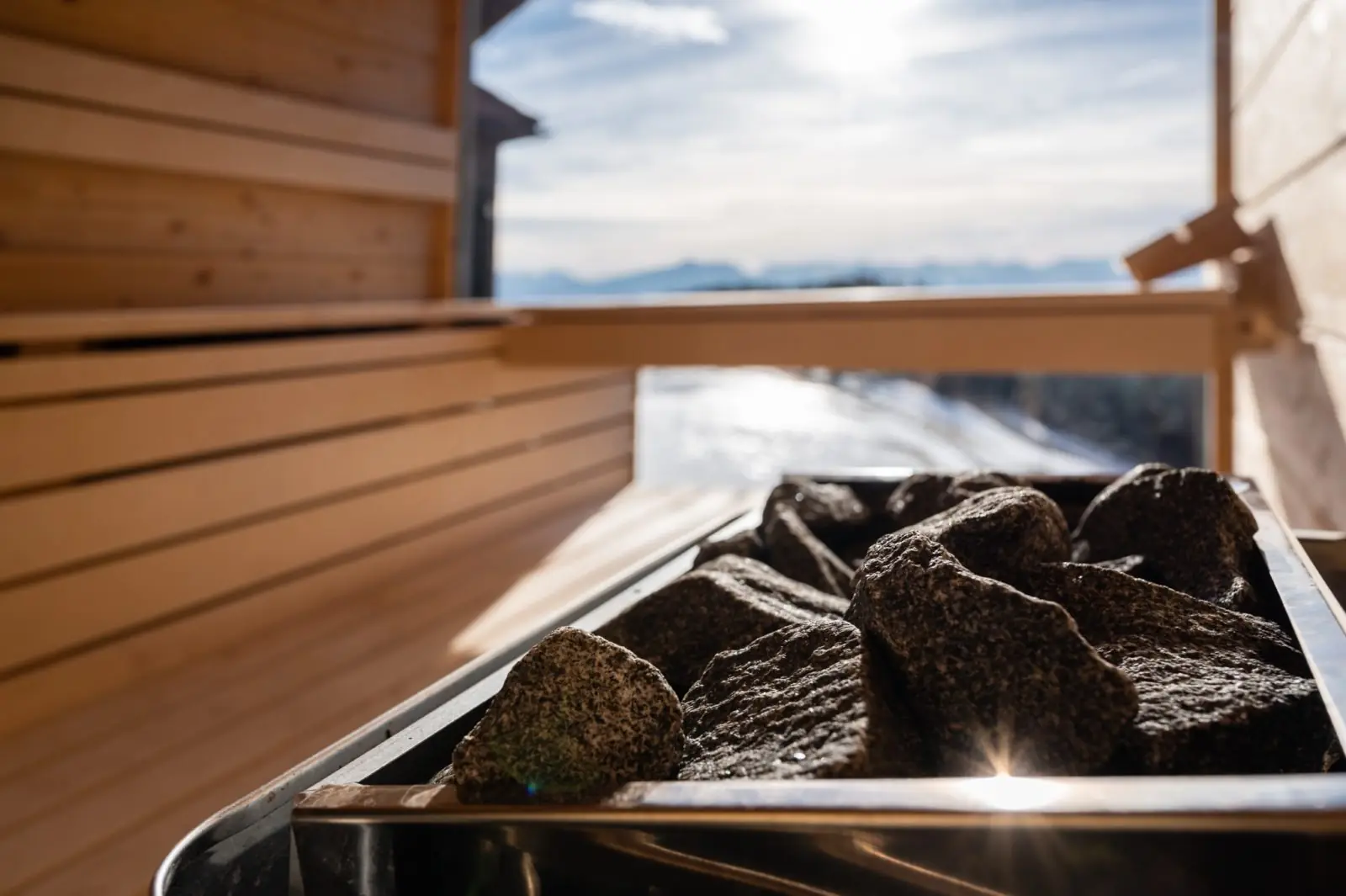 Sauna stove in the sauna hut with a distant view