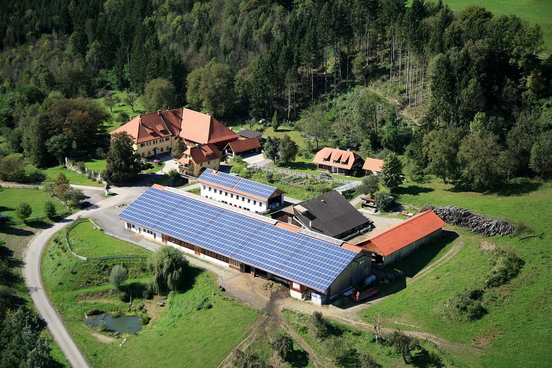 Demeterhof Kraindorf from above with barn, meadows and forest